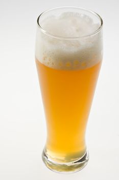 glass of bavarian wheat beer isolated on white