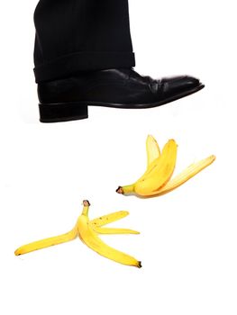 businessman shoe steping a banana