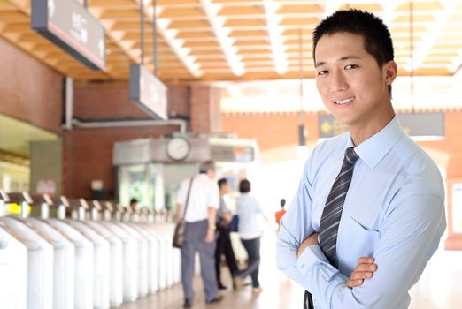 Portrait of happy smiling business man of Asian in station.