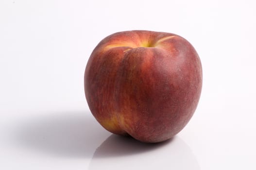 One peach fruit on white background