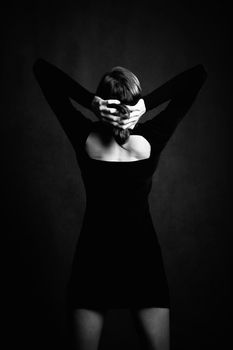 Pretty Woman in a Stretchy Knit Black Dress from Behind