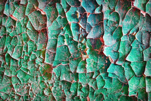 Dirty old cracked paint on the surface of the concrete wall