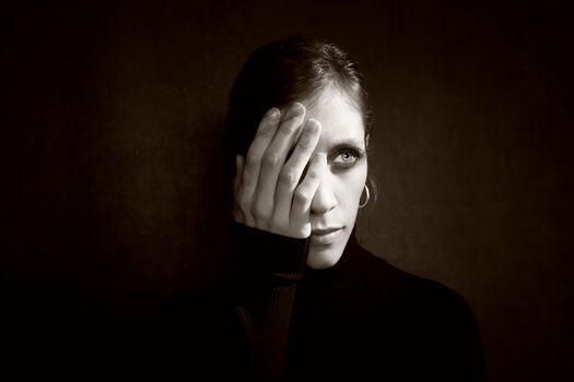 Pretty Woman a Black Turtleneck Covering her Eye