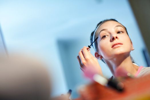 The young woman directs a make-up in the morning before wedding
