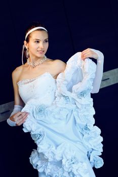 a bride playes with her dress