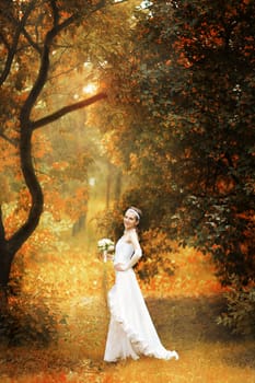 happy bride on autumn forest