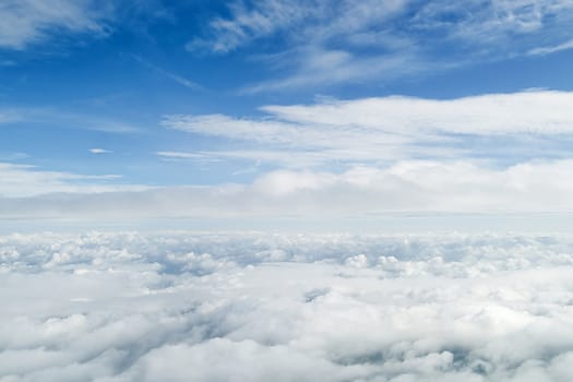 View from airplane window inside the clouds