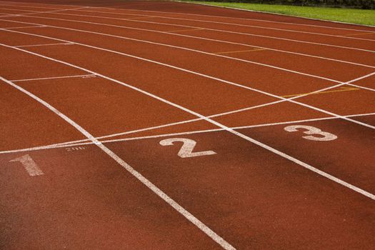 Running lanes on a track in play gorund 