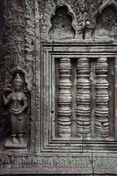 A carved wall of the Angkor temples in Siem Reap, Cambodia.
