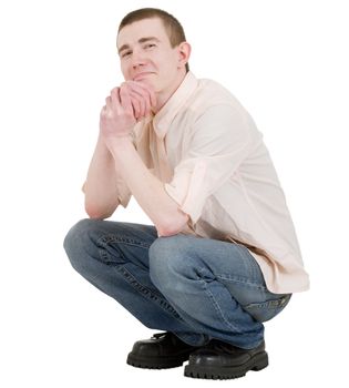 Young man to squat on the white background