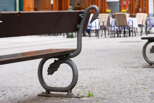 Street bench with the figure of a dragon in the Prague