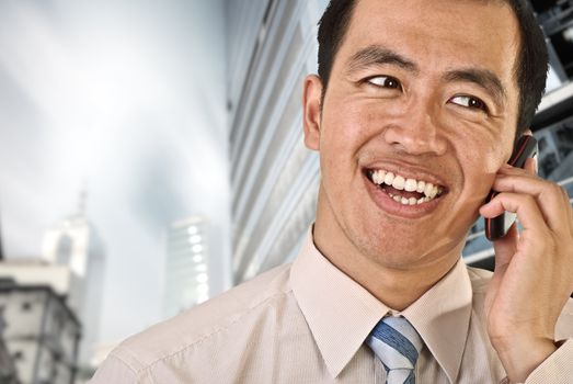 Mature business man use phone outside of office buildings and skyscrapers.