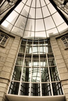 Abstract architecture of modern building with beautiful glass windows.