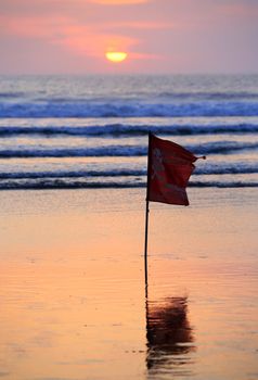 Swimming prohibited around this area flag in Kuta beach Bali
