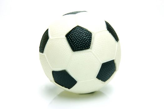 A soccer ball isolated against a green background