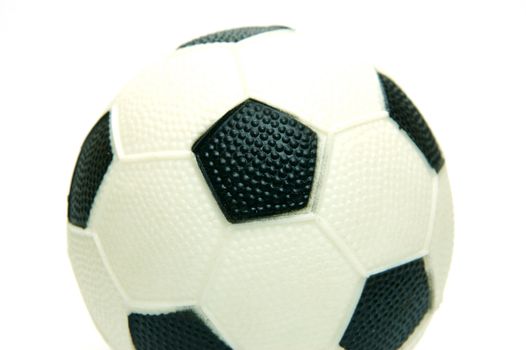 A soccer ball isolated against a green background