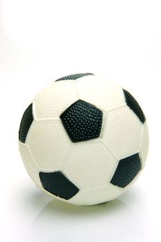A soccer ball isolated against a green background
