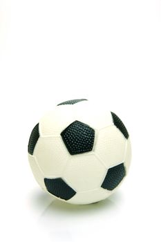 A soccer ball isolated against a green background