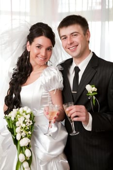 happy bride and groom with champagne