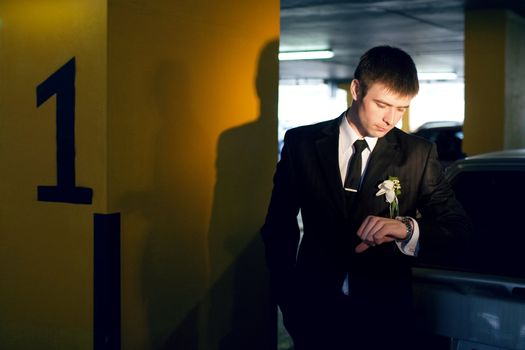 a groom with watch indoors