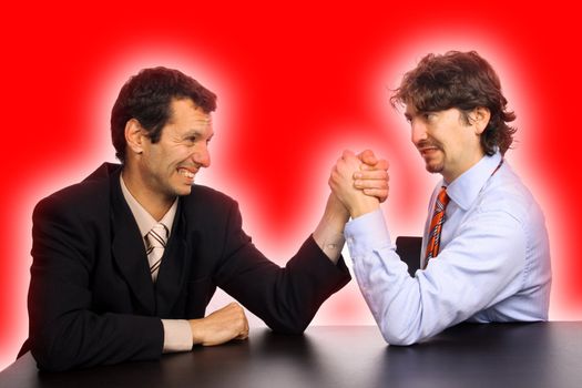 businessmans arm wrestling over white background