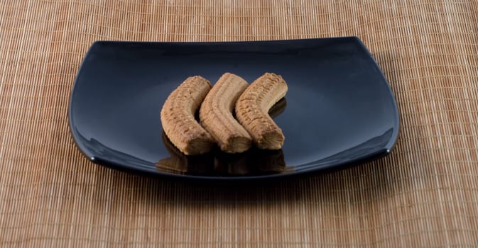 Typical Italian biscuits on a black plate