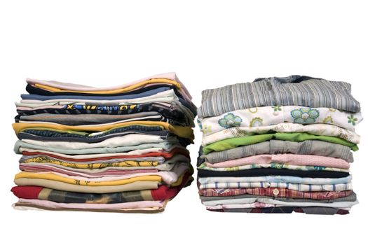 stack of colored t-shirts and shirt, front view, ironed and packed