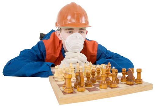 Builder and chess board on the white background