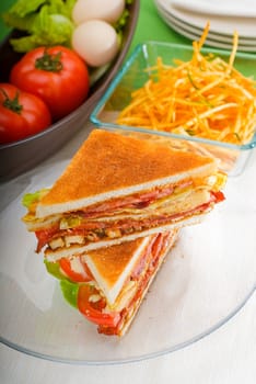 fresh and delicious classic club sandwich over a transparent glass dish