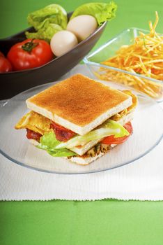 fresh and delicious classic club sandwich over a transparent glass dish