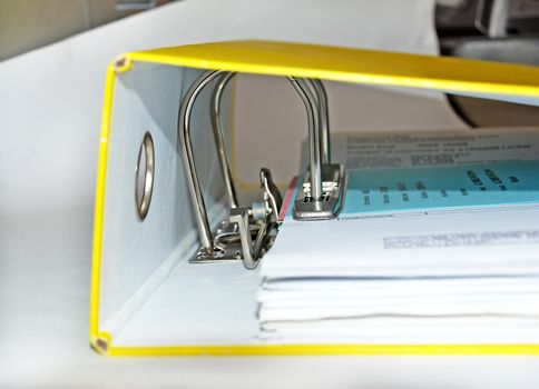 documents in paper file with metallic lock mechanism