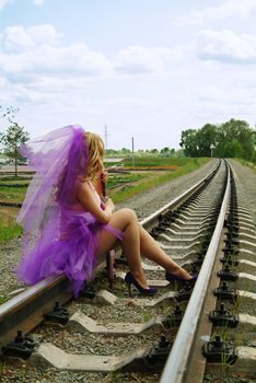 beauty girl sitting on the rail. Suicide.