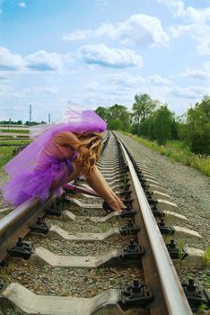 beauty girl sitting on the rail. Suicide.