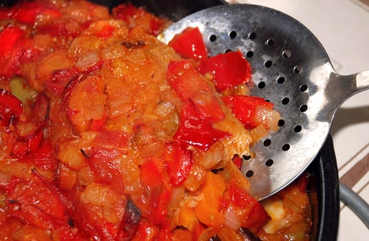 fried paprika, onion, carrot and tomatoes background