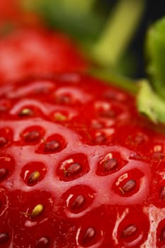 fresh vivid colored strawberry over black background