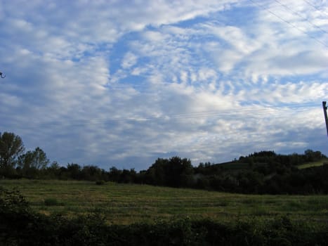 A landscape of hills, fields and sky