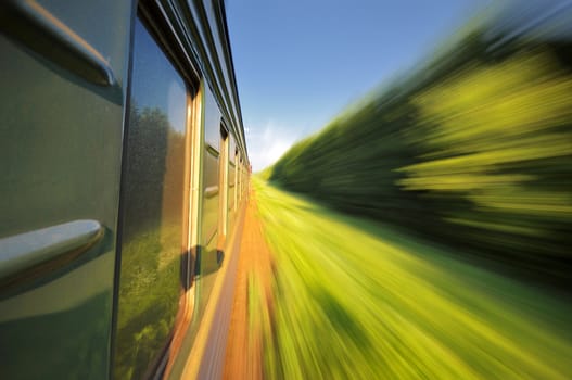 Fast riding a train passenger with motion blur 