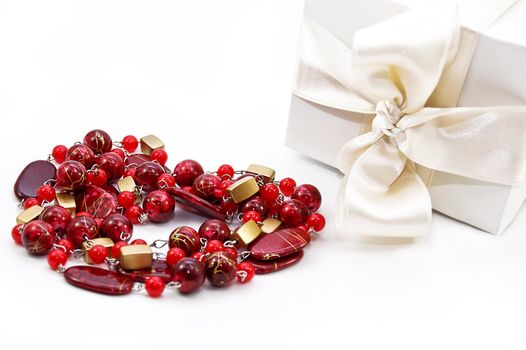 red beads heart shaped and white gift box