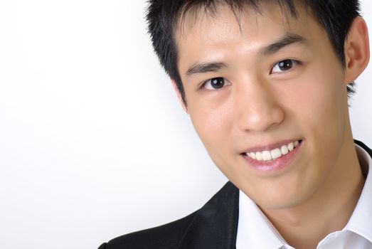 Closeup portrait of young business man of Asian with copyspace on white.