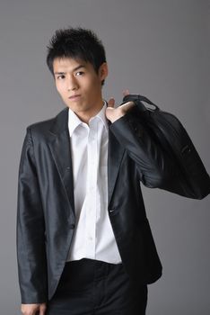 Portrait of young business man of Asian with briefcase.