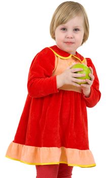 Little girl holding on the hands green apple