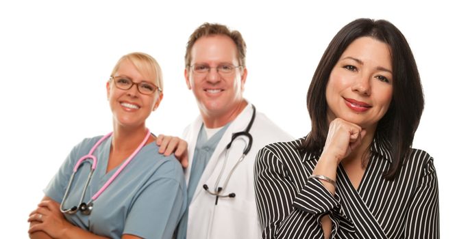 Hispanic Woman with Male Doctor and Nurse Isolated on a White Background.