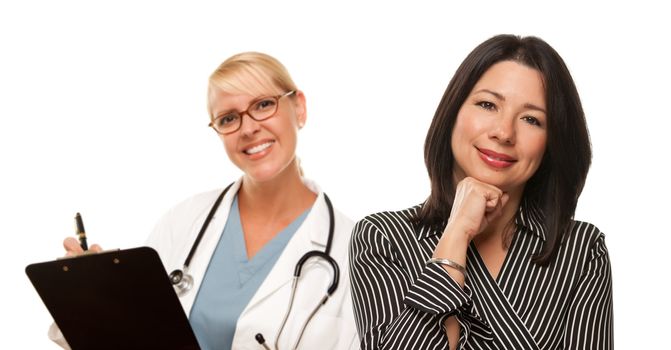Attractive Hispanic Woman with Female Doctor or Nurse Isolated on a White Background.