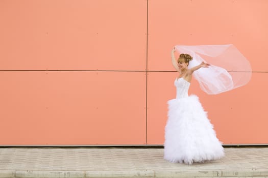 dancing bride near the wall