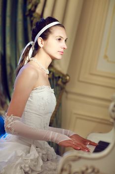 bride playing the grand piano