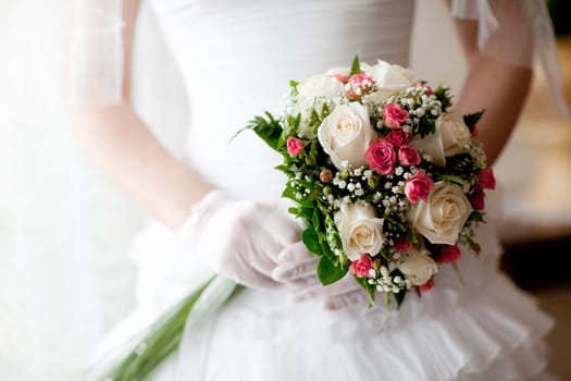 wedding bouquet in hands of the bride