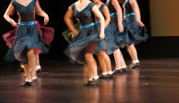 Dancing in costumes on stage