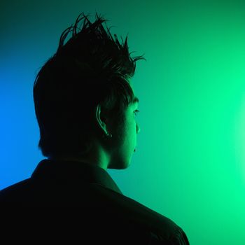 Portrait of attractive young Asian man with spiked hair.