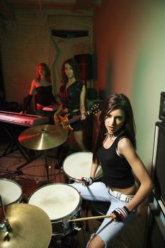 Caucasian girl band with their instruments.