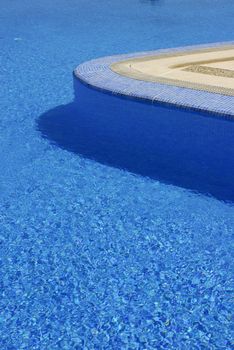 swimming pool blue water in a summer day